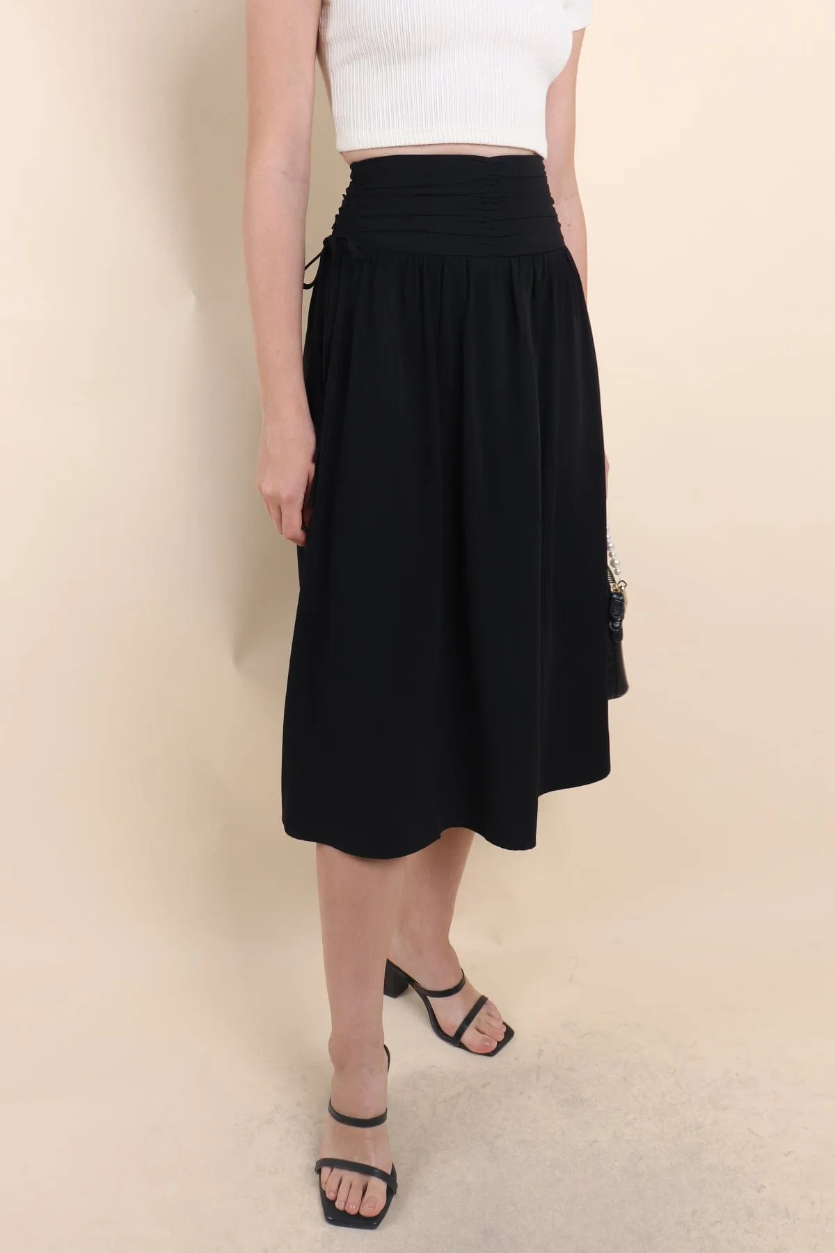 ADORA RUCHED MIDI SKIRT IN BLACK